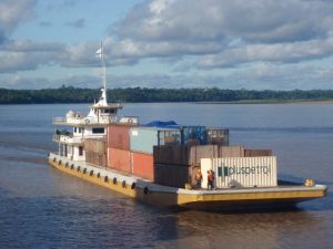 Containers loaded on barge in the Amazon River