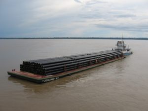 Pipe loaded on barge in the Amazon River